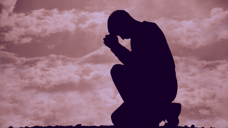 Man praying with clouds in background